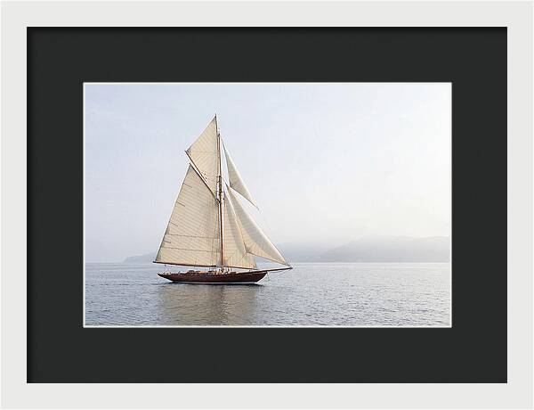 Vintage Wooden Sailboat Under Full Sail