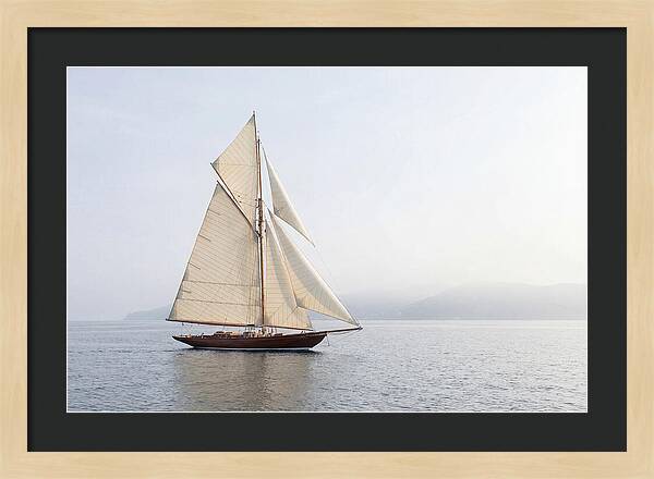 Vintage Wooden Sailboat Under Full Sail