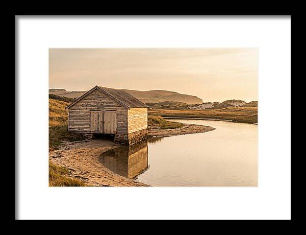Weathered Boathouse Beside Inlet