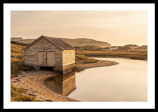 Weathered Boathouse Beside Inlet