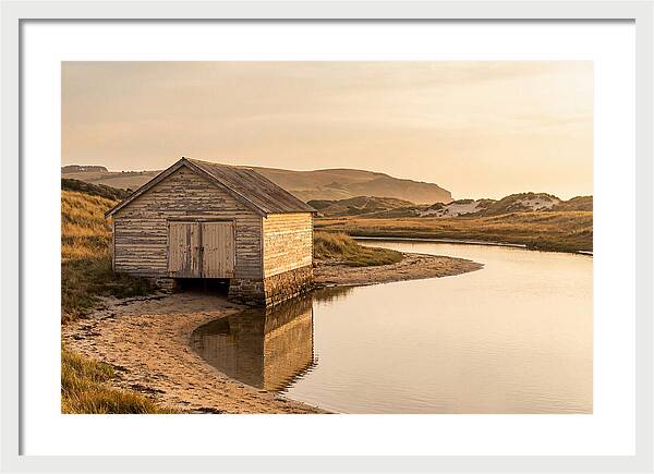 Weathered Boathouse Beside Inlet