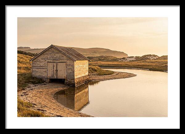 Weathered Boathouse Beside Inlet