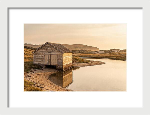 Weathered Boathouse Beside Inlet
