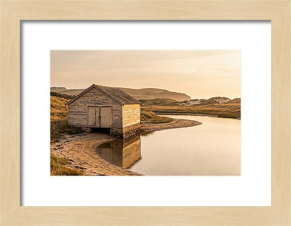 Weathered Boathouse Beside Inlet