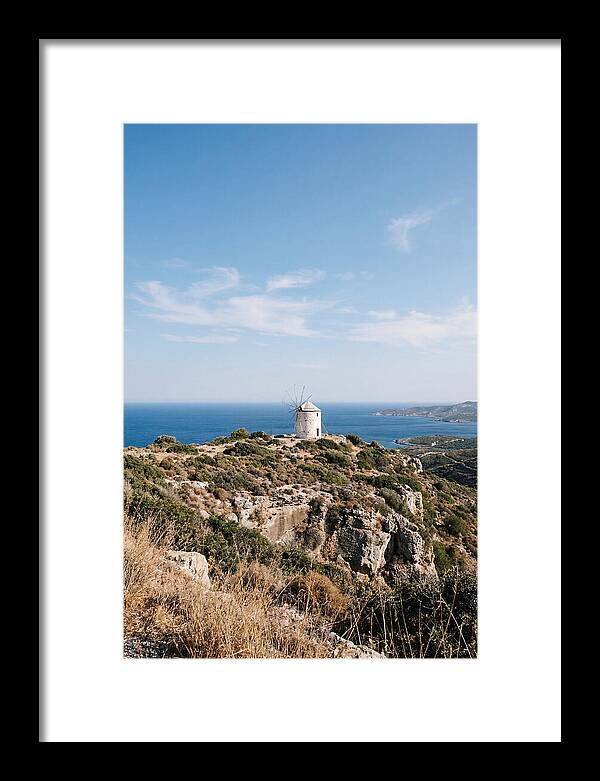White Windmill Against Deep Blue Sky