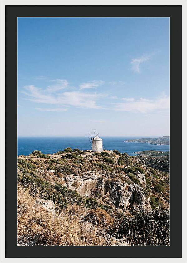 White Windmill Against Deep Blue Sky