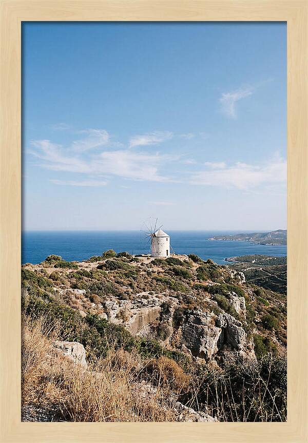 White Windmill Against Deep Blue Sky