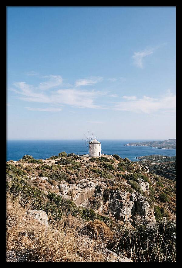 White Windmill Against Deep Blue Sky
