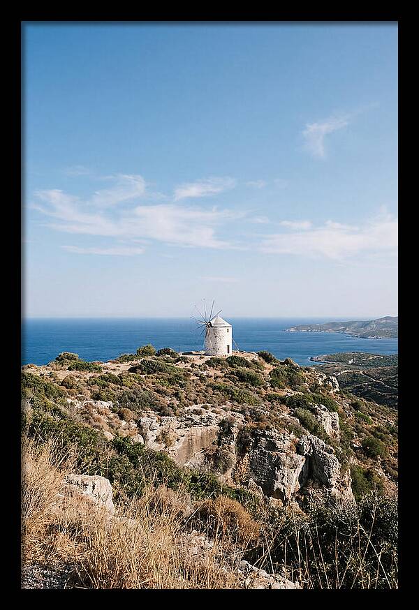 White Windmill Against Deep Blue Sky