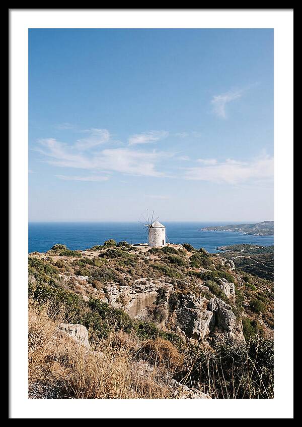 White Windmill Against Deep Blue Sky