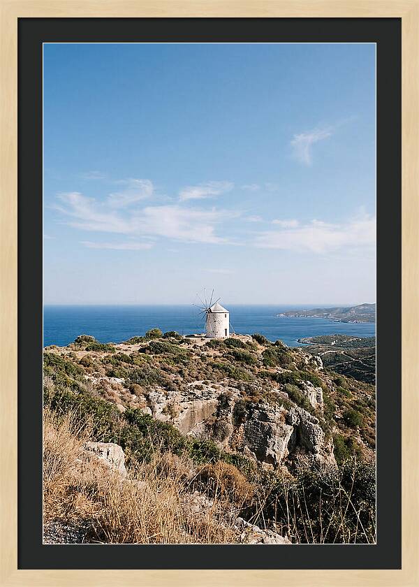 White Windmill Against Deep Blue Sky