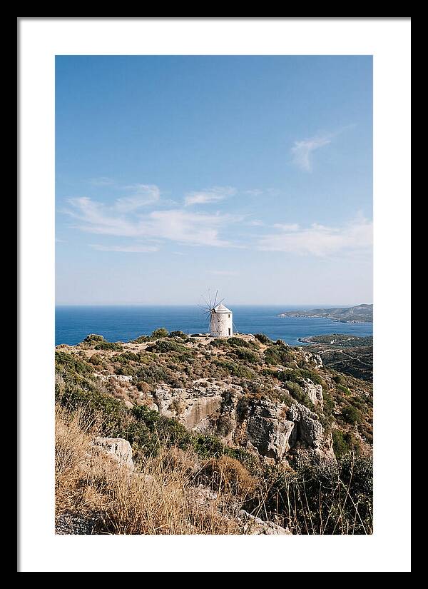 White Windmill Against Deep Blue Sky