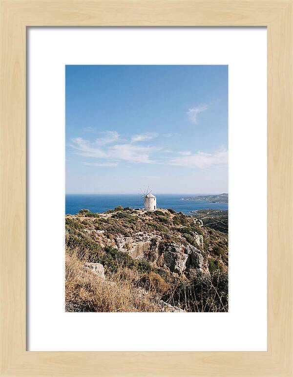 White Windmill Against Deep Blue Sky
