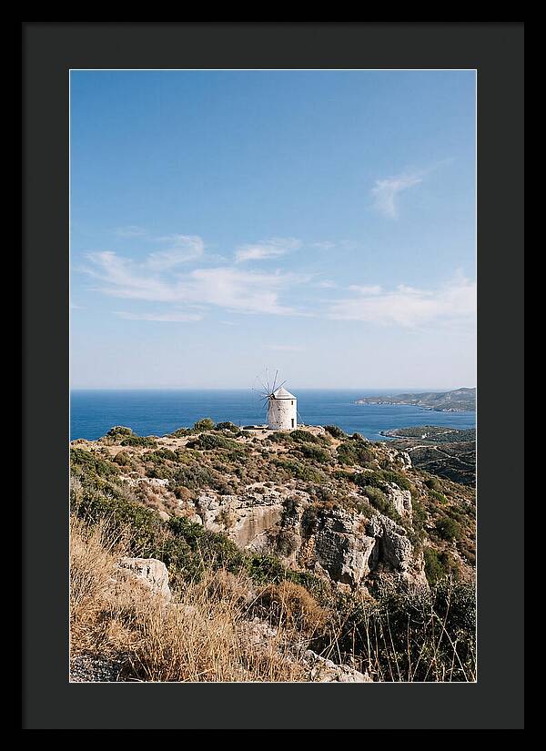 White Windmill Against Deep Blue Sky