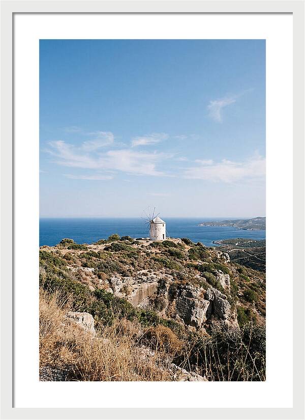 White Windmill Against Deep Blue Sky