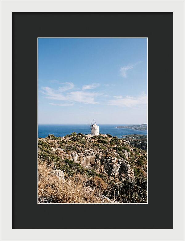 White Windmill Against Deep Blue Sky