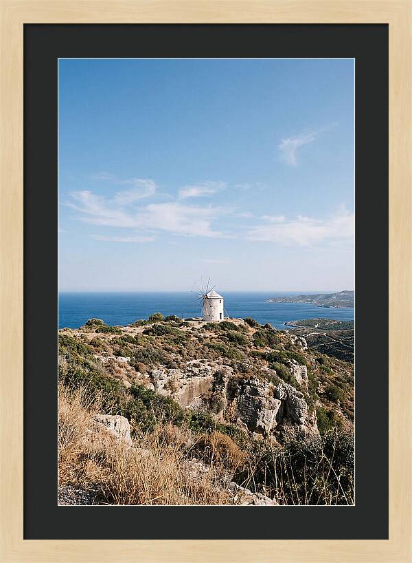 White Windmill Against Deep Blue Sky