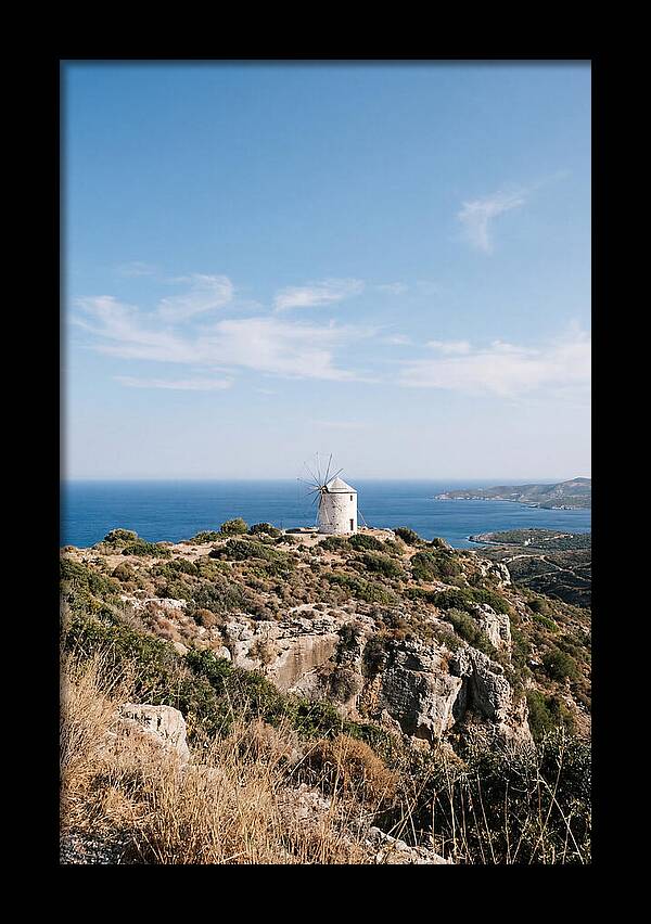 White Windmill Against Deep Blue Sky