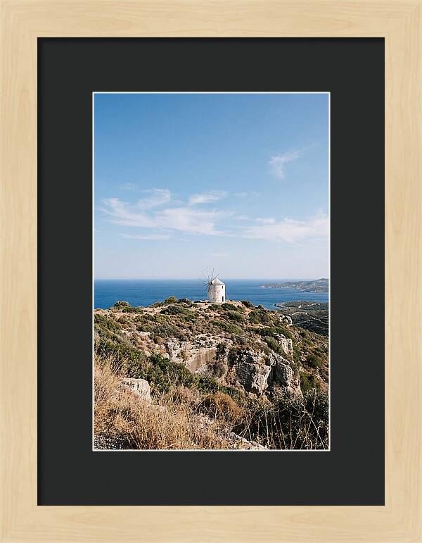 White Windmill Against Deep Blue Sky