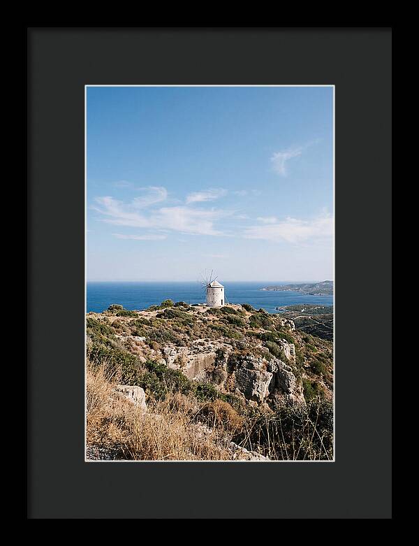 White Windmill Against Deep Blue Sky