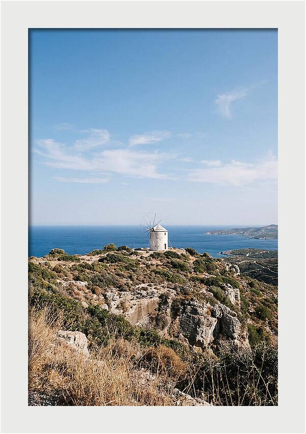 White Windmill Against Deep Blue Sky