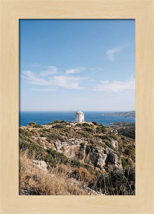 White Windmill Against Deep Blue Sky