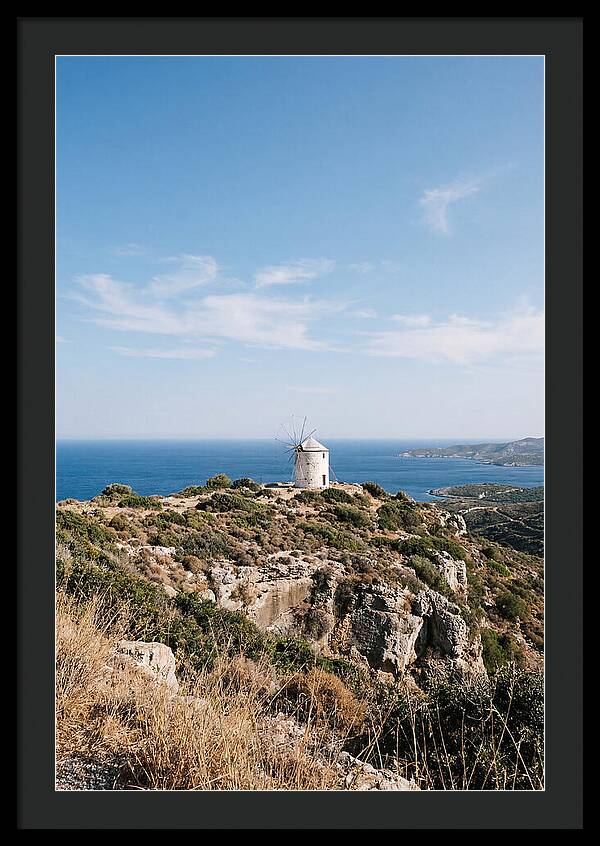 White Windmill Against Deep Blue Sky