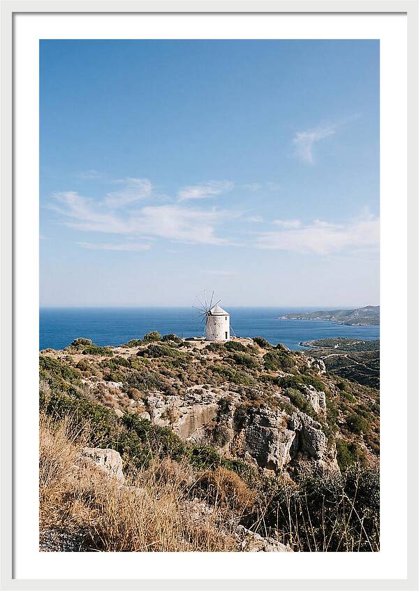 White Windmill Against Deep Blue Sky