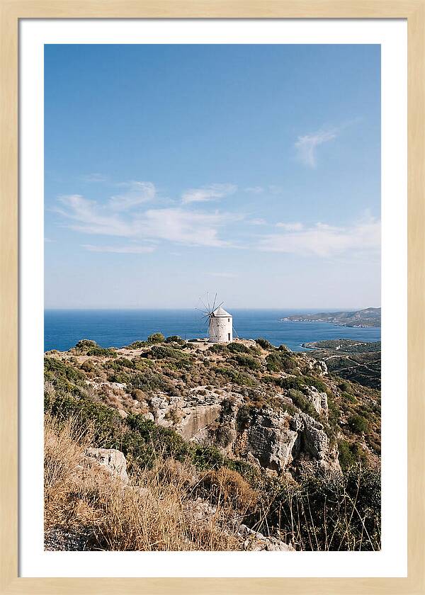 White Windmill Against Deep Blue Sky