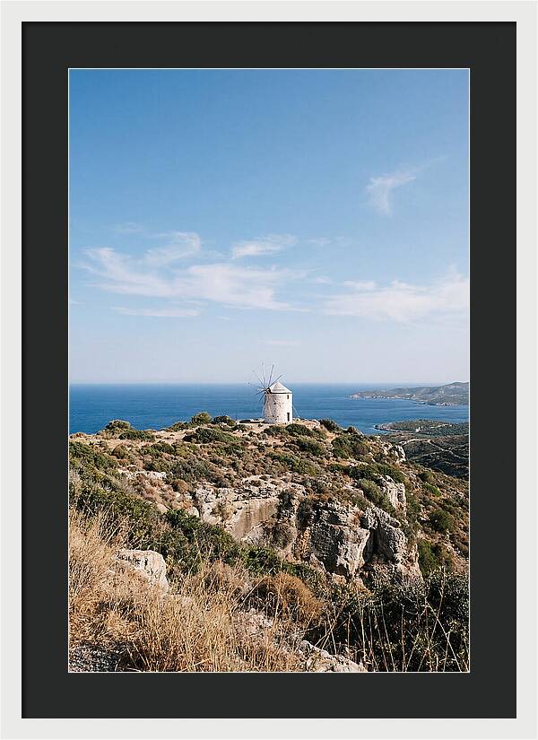 White Windmill Against Deep Blue Sky