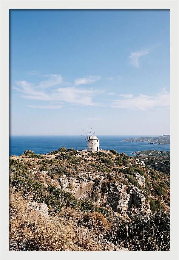 White Windmill Against Deep Blue Sky