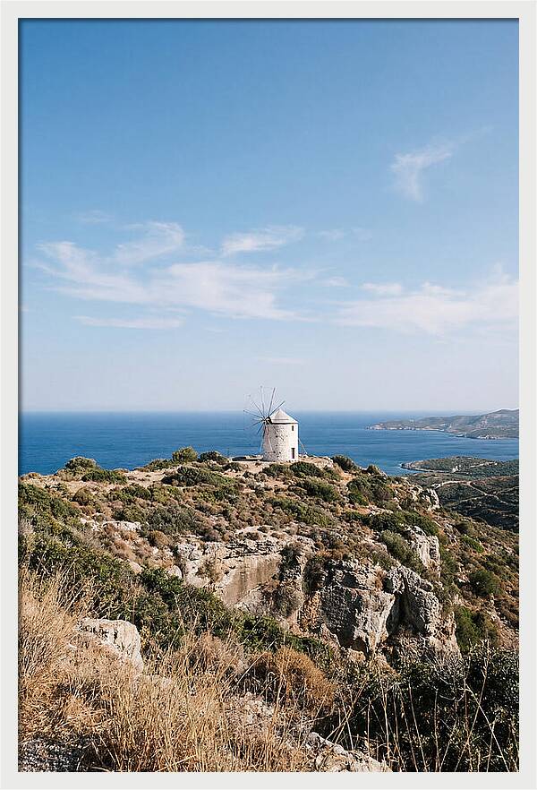 White Windmill Against Deep Blue Sky