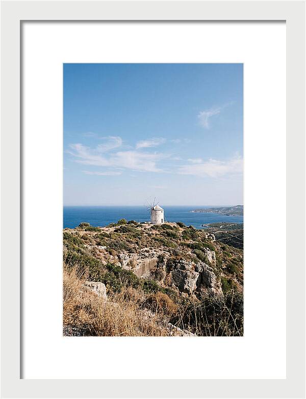 White Windmill Against Deep Blue Sky