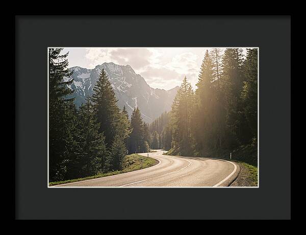 Winding Road Through Alpine Landscape