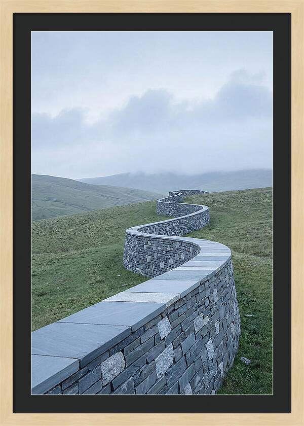 Winding Stone Wall Through Green Hills
