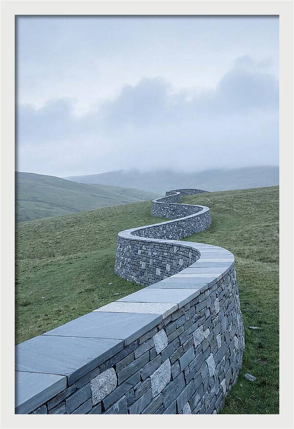 Winding Stone Wall Through Green Hills