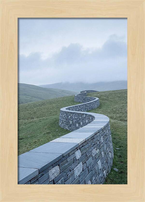 Winding Stone Wall Through Green Hills