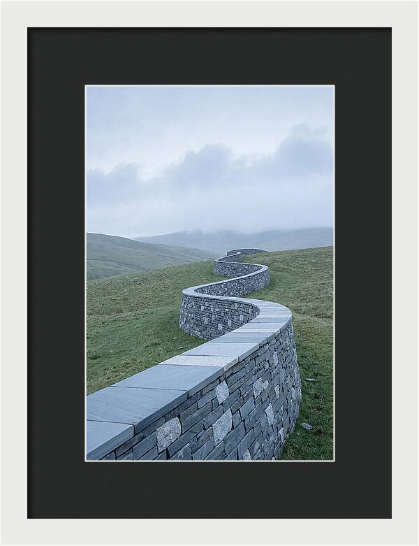 Winding Stone Wall Through Green Hills