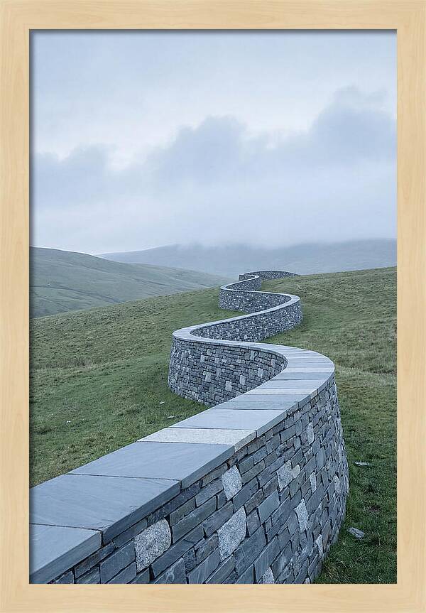 Winding Stone Wall Through Green Hills