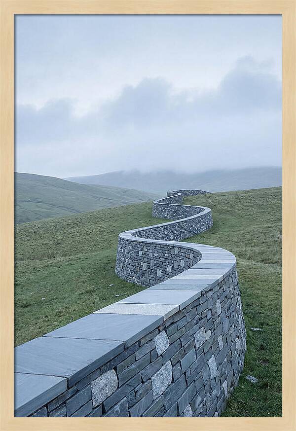 Winding Stone Wall Through Green Hills
