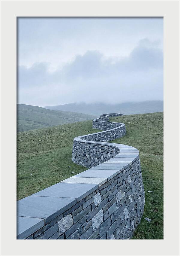 Winding Stone Wall Through Green Hills