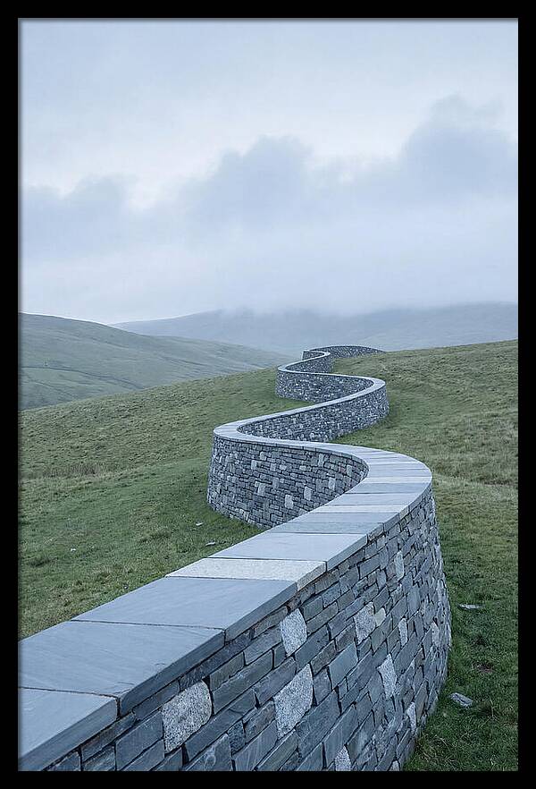 Winding Stone Wall Through Green Hills