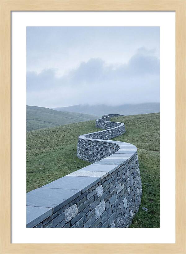 Winding Stone Wall Through Green Hills