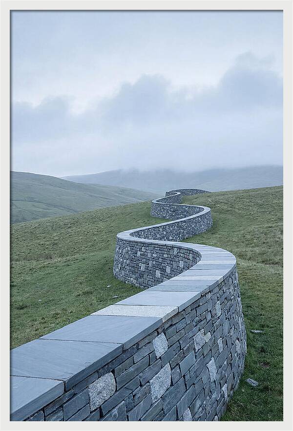 Winding Stone Wall Through Green Hills