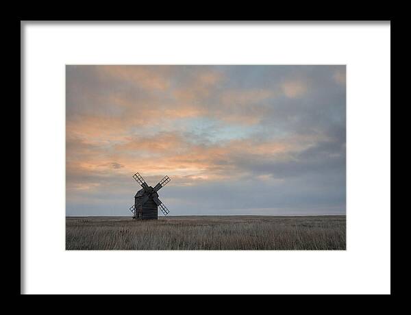 Windmill Silhouetted Against Orange Sky