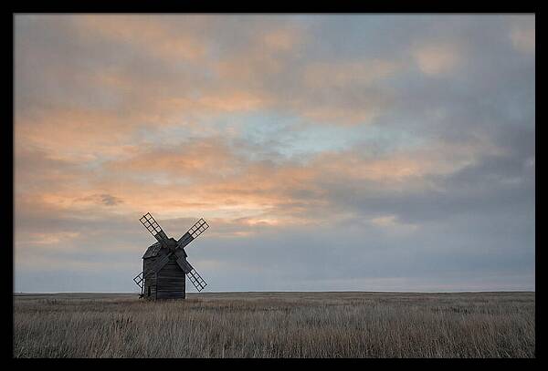 Windmill Silhouetted Against Orange Sky