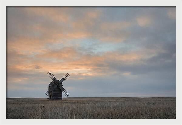 Windmill Silhouetted Against Orange Sky