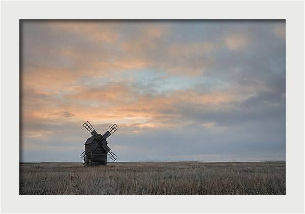Windmill Silhouetted Against Orange Sky