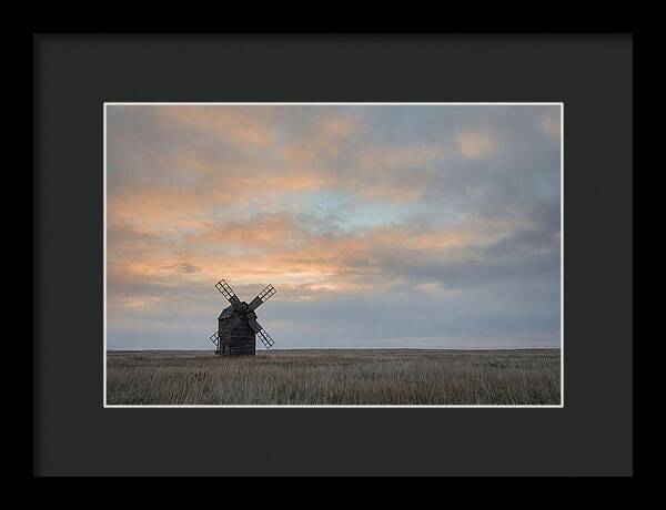 Windmill Silhouetted Against Orange Sky