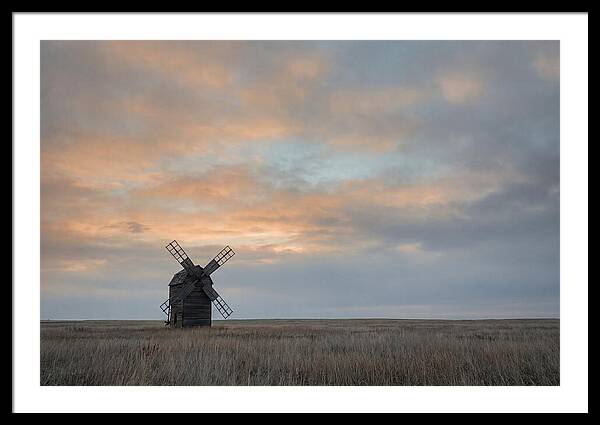 Windmill Silhouetted Against Orange Sky